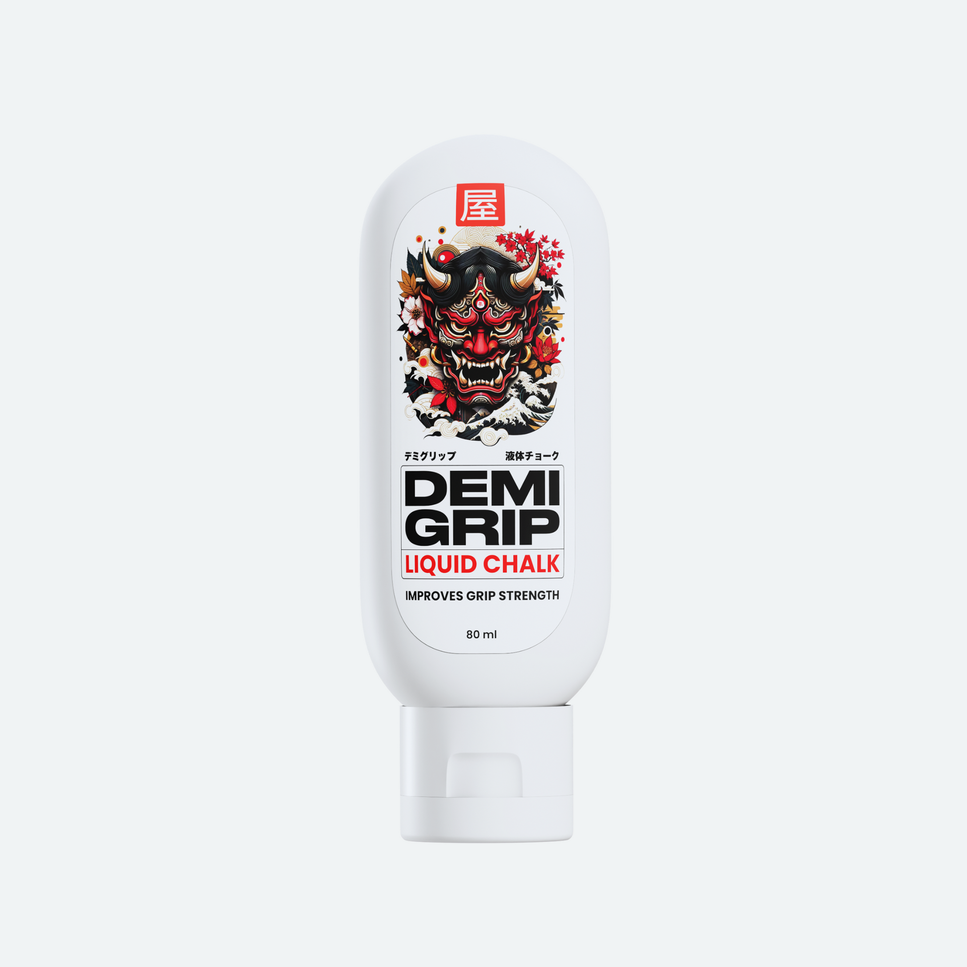 A white bottle of Demi Grip Liquid Chalk, featuring a bold and striking label with a traditional Japanese Oni (demon) mask design. The product name 'DEMI GRIP' is prominently displayed in black text, with 'LIQUID CHALK' written below in red. The label also includes the phrase 'IMPROVES GRIP STRENGTH' and indicates a 60 ml capacity. The overall design combines modern typography with cultural imagery for a unique and eye-catching appearance.