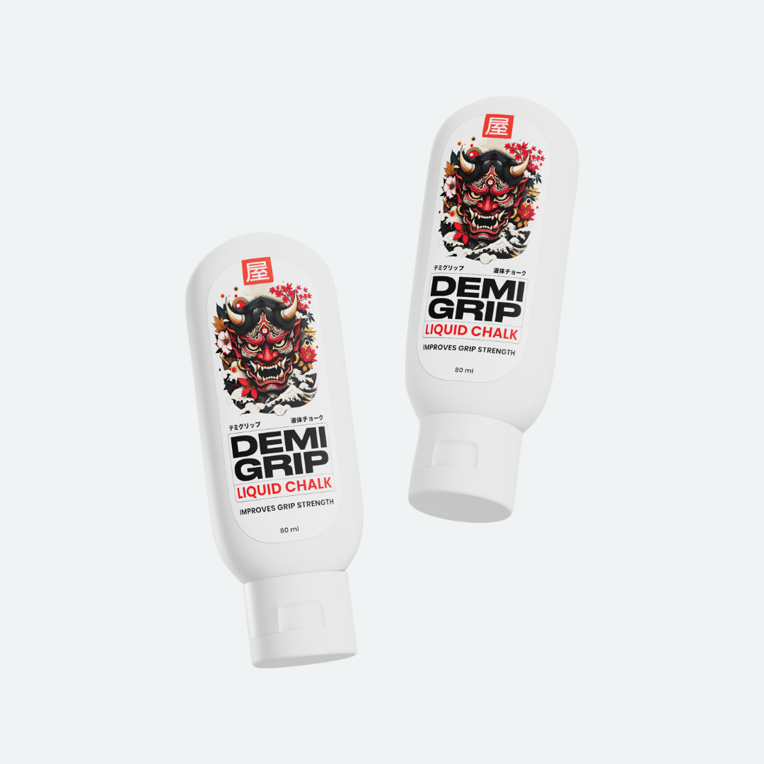 Two bottles of DEMIGRIP Liquid Chalk featuring a bold red demon mask design on a white background, labeled to improve grip strength with 80 ml capacity
